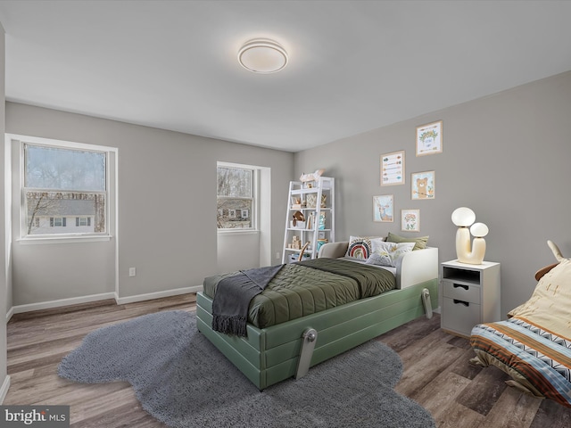 bedroom with hardwood / wood-style floors