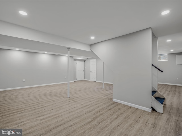 basement featuring light wood-type flooring