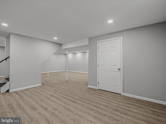 basement with light wood-type flooring