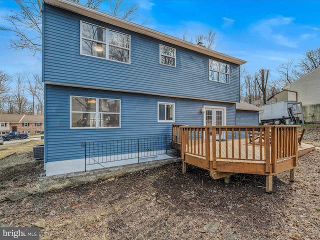 back of property with a wooden deck and central AC unit