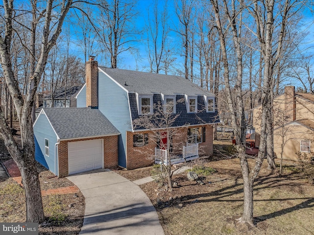 view of property featuring a garage and covered porch