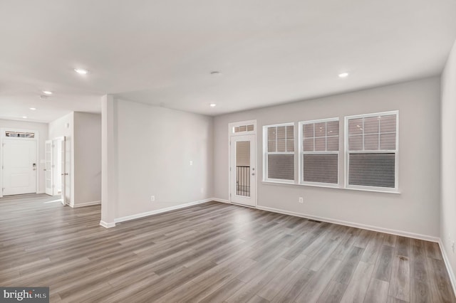 unfurnished room featuring light hardwood / wood-style floors