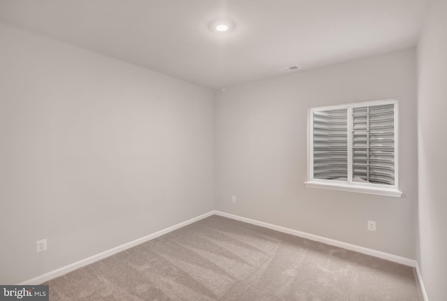 empty room with carpet flooring