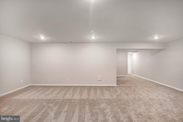 basement with light colored carpet