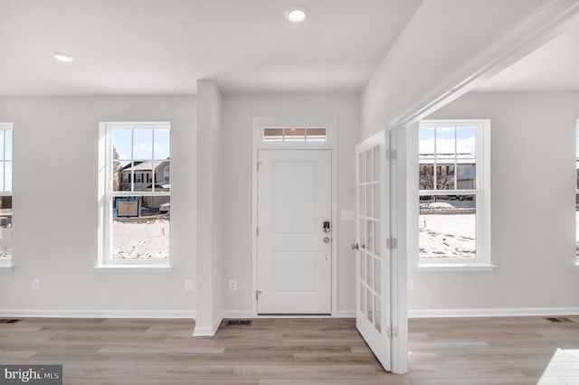 foyer entrance featuring light hardwood / wood-style flooring