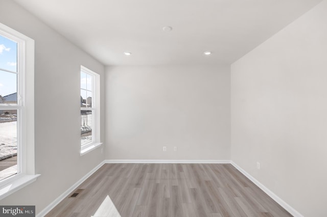 unfurnished room featuring light wood-type flooring