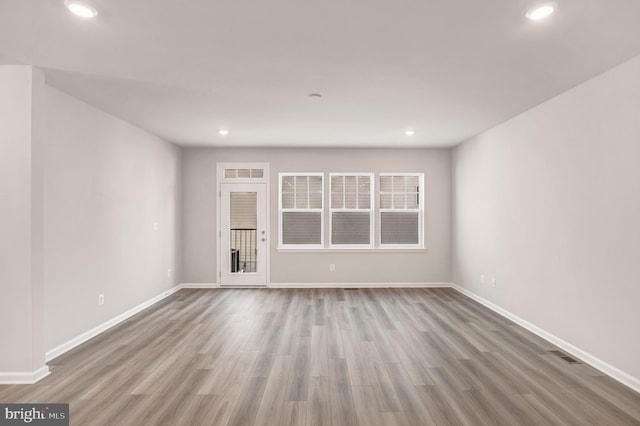 spare room featuring hardwood / wood-style floors