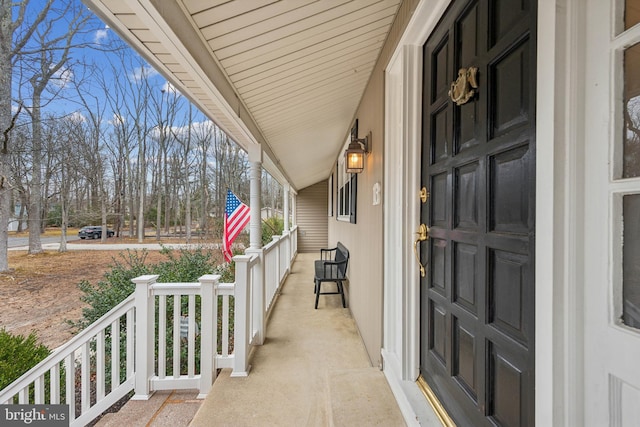 view of exterior entry with covered porch