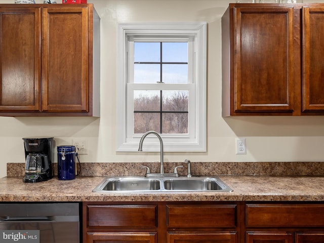 kitchen featuring black dishwasher and sink