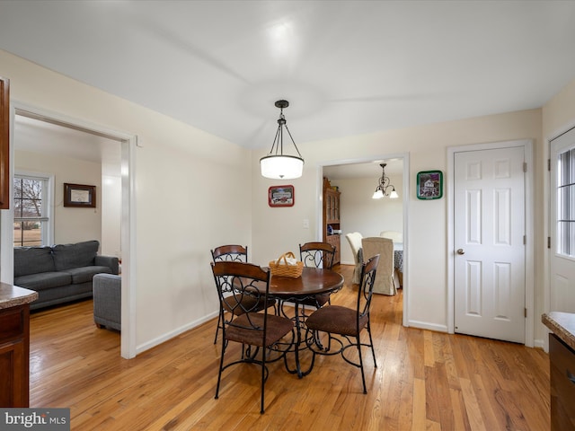 dining area featuring light wood-type flooring