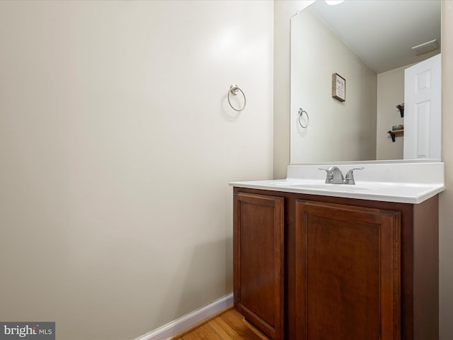 bathroom featuring vanity and wood-type flooring