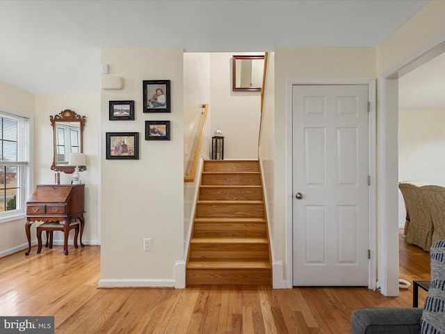 stairs with hardwood / wood-style floors