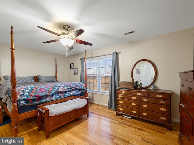 bedroom with light hardwood / wood-style flooring and ceiling fan