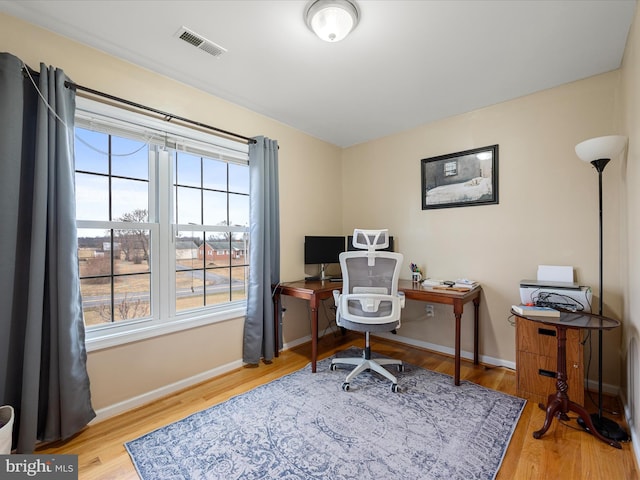 office with light hardwood / wood-style floors