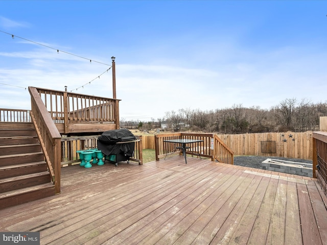 wooden deck with grilling area