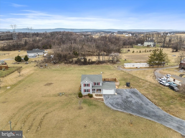 birds eye view of property with a rural view