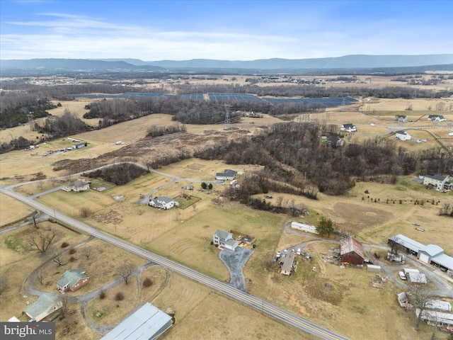 drone / aerial view with a mountain view and a rural view