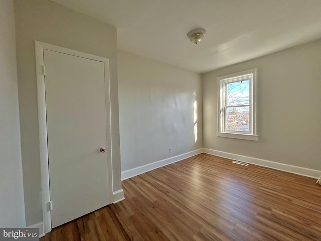 empty room featuring hardwood / wood-style floors