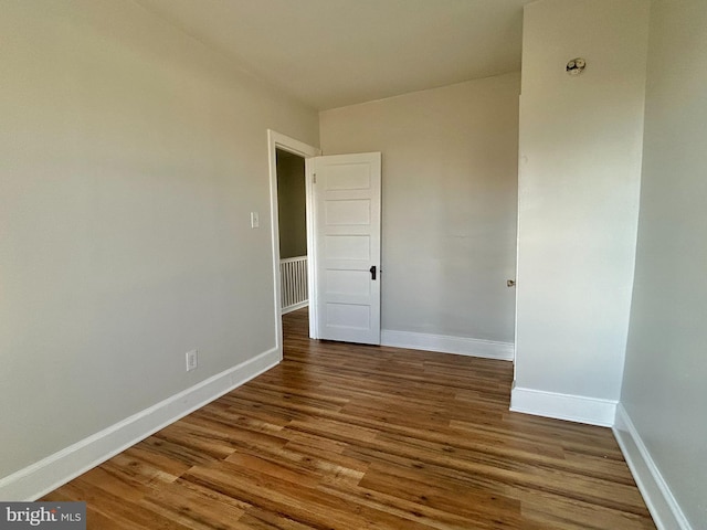 spare room featuring hardwood / wood-style floors