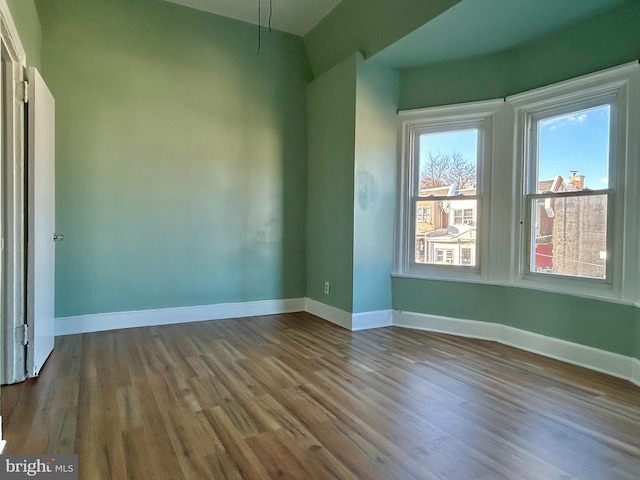 empty room with wood-type flooring