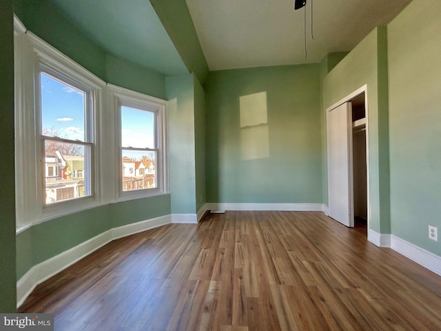 unfurnished room featuring hardwood / wood-style floors