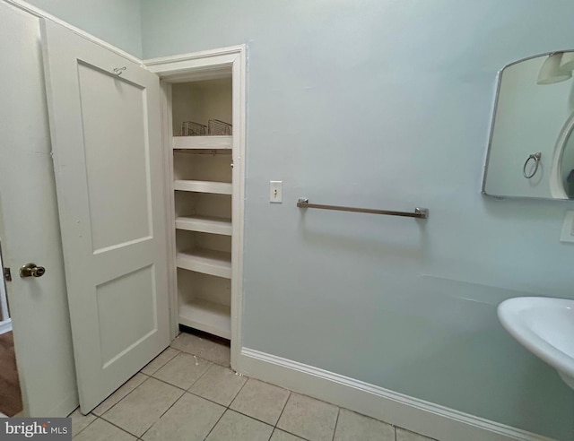 bathroom featuring sink and tile patterned flooring