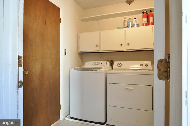 laundry area featuring cabinets and washer and dryer