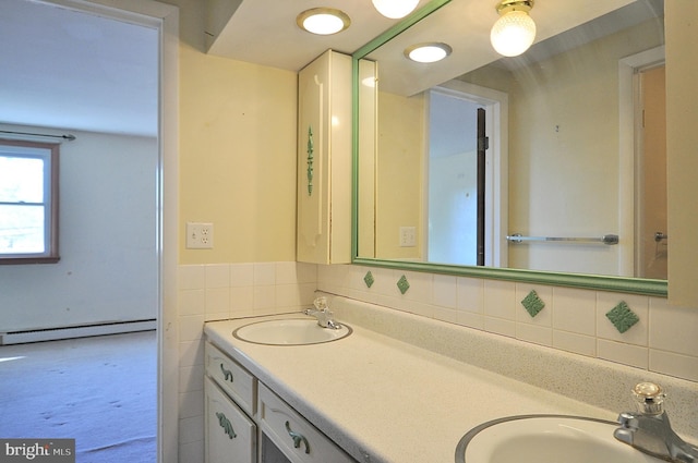 bathroom featuring vanity and a baseboard radiator