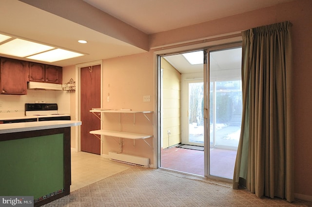 kitchen featuring light carpet, backsplash, range with electric stovetop, and baseboard heating