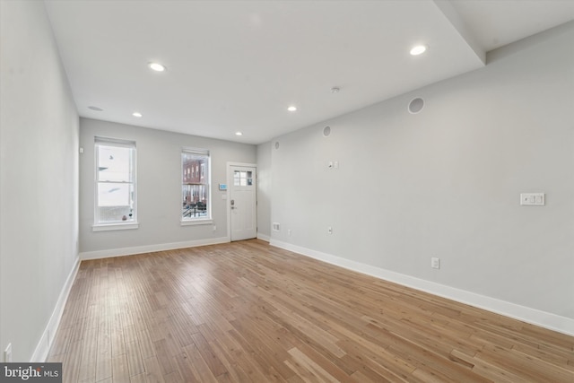 spare room with light hardwood / wood-style flooring