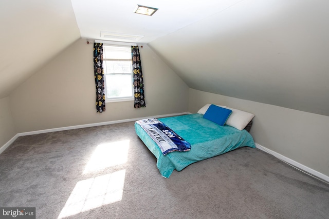 carpeted bedroom featuring vaulted ceiling