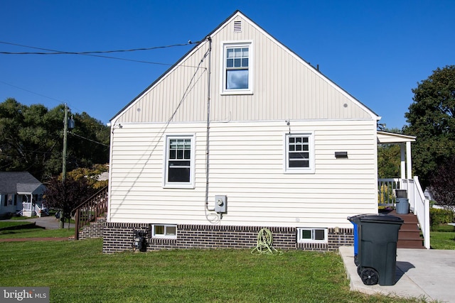 view of property exterior with a yard