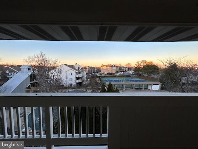 view of balcony at dusk