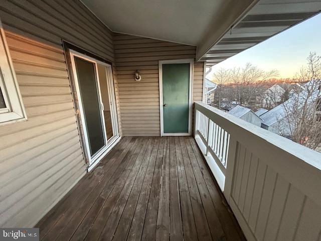 view of balcony at dusk