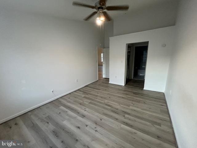 unfurnished bedroom featuring ceiling fan, connected bathroom, and light hardwood / wood-style floors