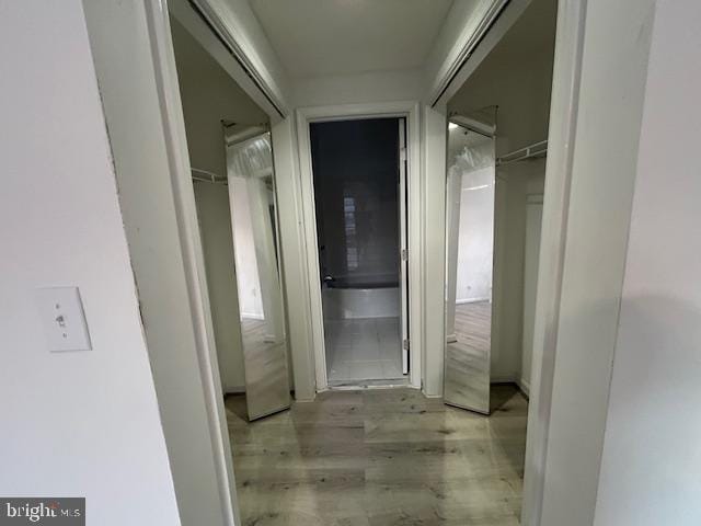 hallway featuring light hardwood / wood-style flooring