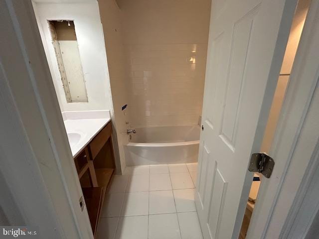 bathroom with tile patterned flooring and vanity