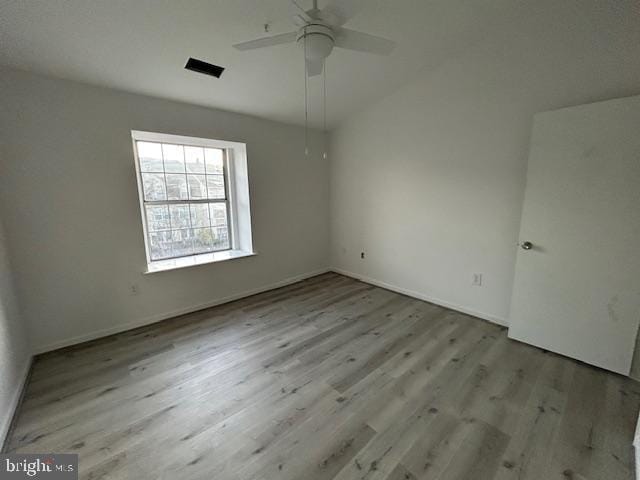 spare room featuring light hardwood / wood-style flooring and ceiling fan