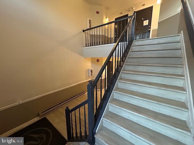 staircase with a towering ceiling