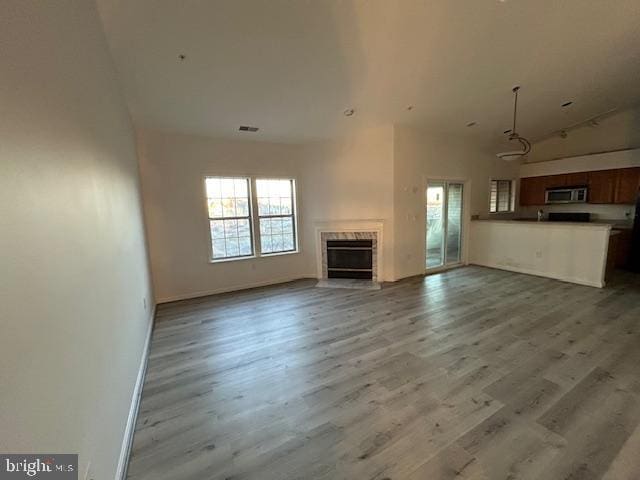 unfurnished living room featuring wood-type flooring