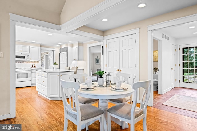 dining room featuring light hardwood / wood-style flooring