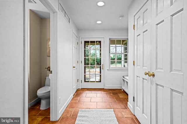 doorway to outside featuring light tile patterned floors