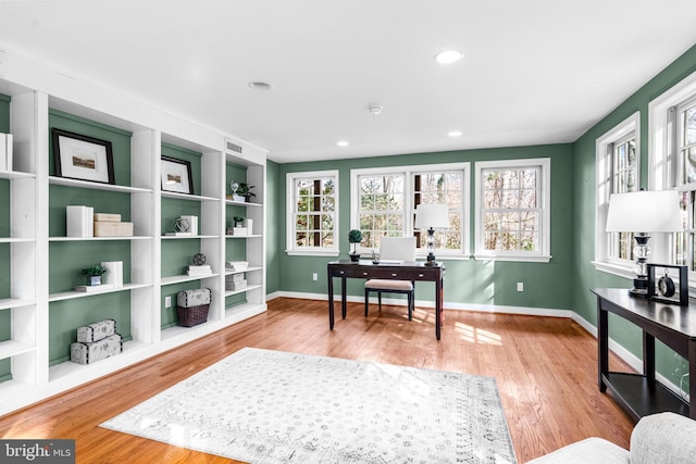 office with light hardwood / wood-style floors