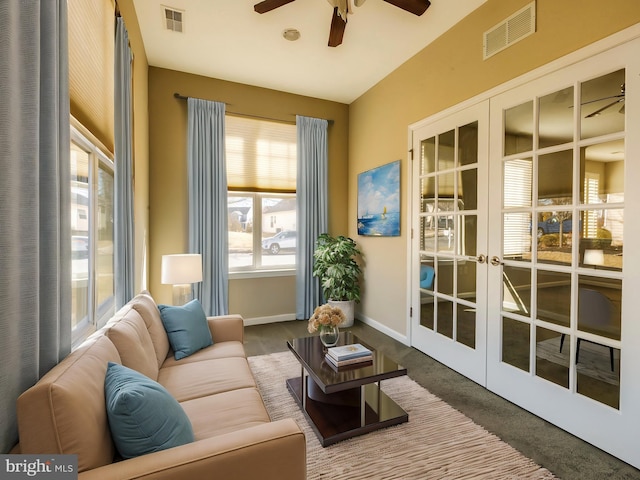 sunroom with french doors and ceiling fan