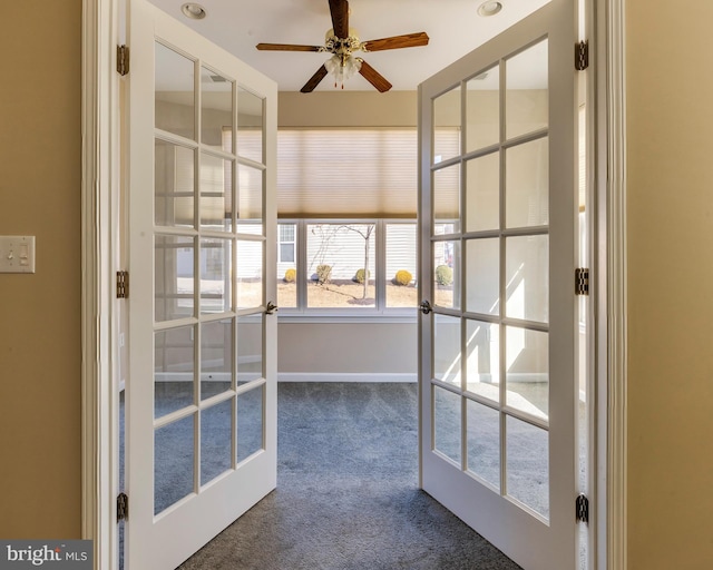 unfurnished sunroom featuring french doors and ceiling fan