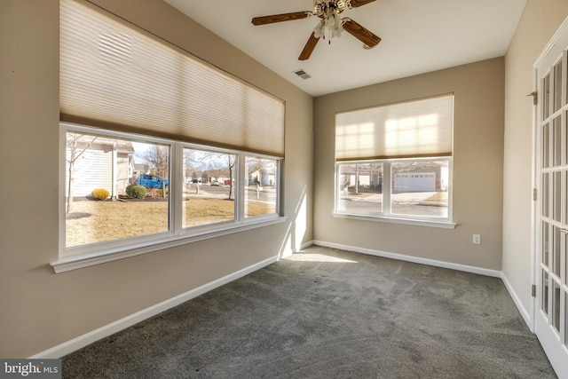 empty room featuring carpet and ceiling fan