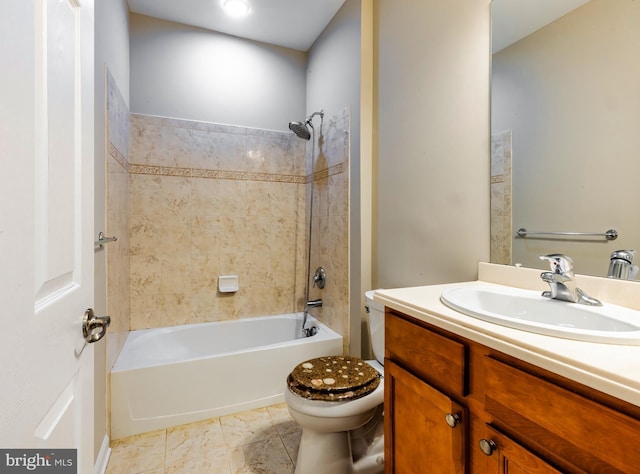 full bathroom with vanity, toilet, and tiled shower / bath