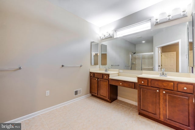 bathroom featuring walk in shower, vanity, and tile patterned flooring