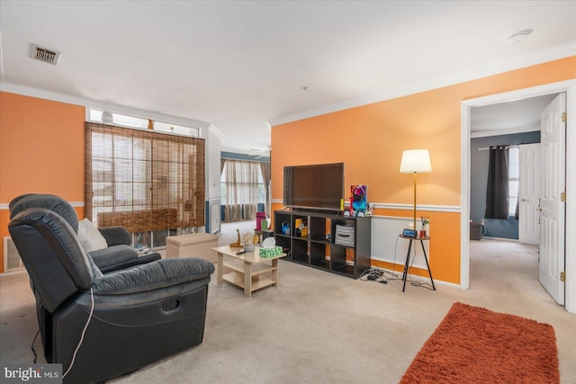 living room featuring ornamental molding and light carpet