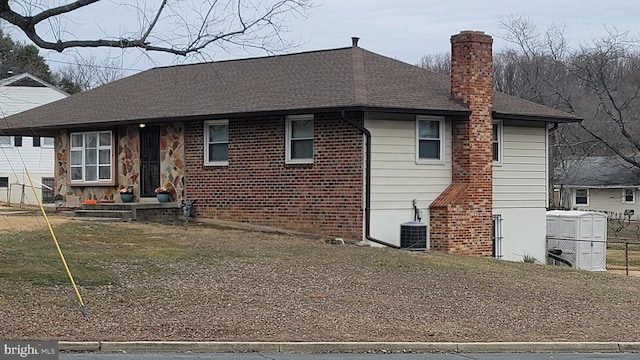 view of front of house with central air condition unit